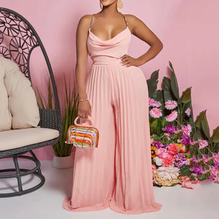 Fashionable women’s clothing including dresses, tops, and pants arranged on stylish racks with modern accessories